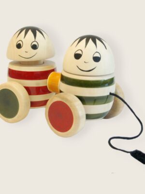 a wooden toy with faces on wheels